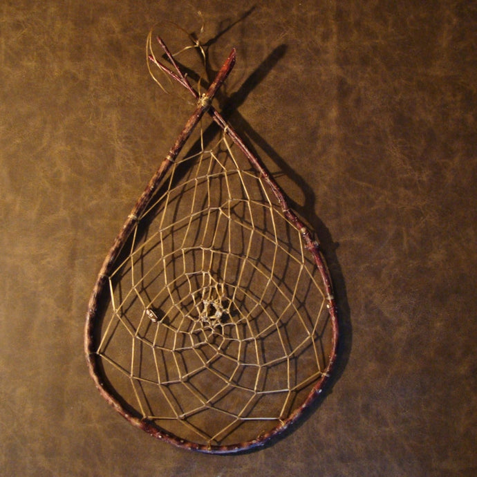 Handwoven Native American Indian (Ojibwe) dreamcatcher. Created in the Ojibwe traditional method from real willow sticks with a handcarved bone pony bead. (Colored by wild berries.)
