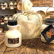 A combo girt bag filled with maple syrup, frybread mix, and 1/2 lb. of Bineshii gourmet wild rice.